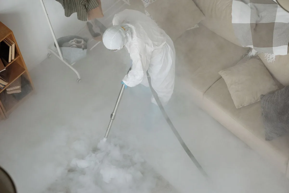 Biohazard cleanup technician in protective equipment, Huguley, AL